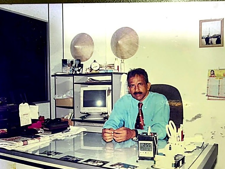 Five A Travel's founder at the original China Street office in the early years